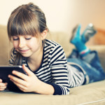 Little girl and a tablet