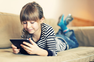 Little girl and a tablet